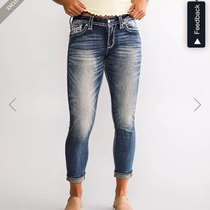 Woman’s buckle jeans rock revival